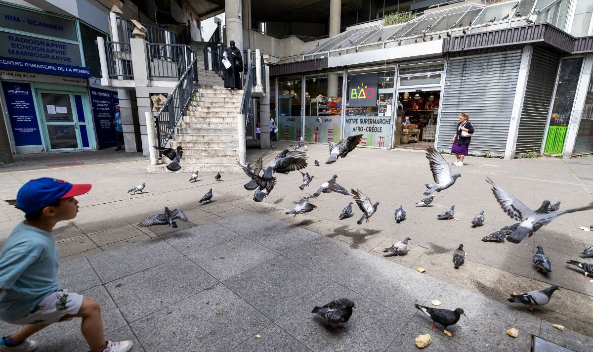 A rundown housing and shopping complex in Saint-Denis